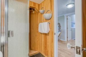 a bathroom with a shower and a towel rack at The Turtles Nest in Waldport +101 photos