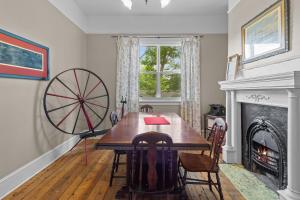a dining room with a table and a fireplace at Hamilton Hilltop Home3 King Bedsvictoria Park in St. John's