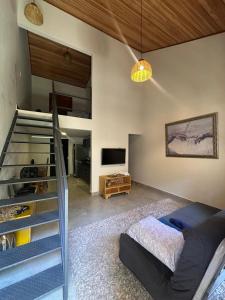 TV a/nebo společenská místnost v ubytování Loft Rio da Mata