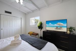 En eller flere senge i et værelse på Bo's Beach Bungalow