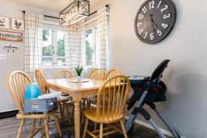 a dining room with a table and a exercise bike at Legends Landing Home Close To ND in South Bend