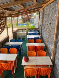 a row of tables and chairs in a restaurant at Renova-Immo in Yaoundé