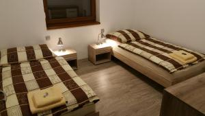 Llit o llits en una habitació de Chalupa na Lipně - Holiday House 1