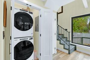 a laundry room with a washer and dryer in a house at Lakeview A-Frame in Canyon Lake