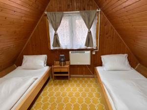 Letto o letti in una camera di Chata Jánošík