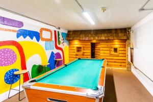a pool table in a room with a mural at Laurel Point Resort in Gatlinburg +10 photos