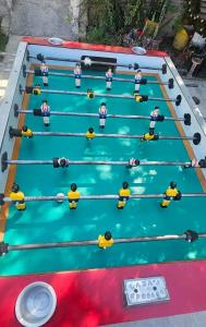 a group of people playing a game of pool at Casa Amarilla Tecámac in Santa Cruz Tecamac
