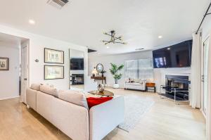 a living room with a couch and a table at Bright & Luxury Entire House in Peaceful Neighborhood in Leander