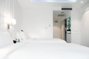 Postel nebo postele na pokoji v ubytování Hotel Tano Guam