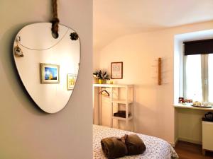 a bedroom with a mirror and a bed at Calin Apartment in Turin