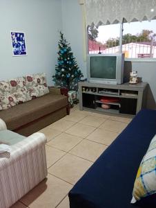 Et tv og/eller underholdning på Pousada Maria