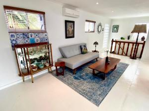 a living room with a couch and a table at Casa Finchette rooftop apartment with panoramic views of Table Mountain in Cape Town