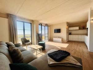 Ένα ή περισσότερα κρεβάτια σε δωμάτιο στο Ferienhaus Seeblick 19 Feriendorf Klein Stresow Rügen by ruyastay