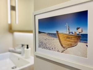 Koupelna v ubytování Ferienhaus Boddenstern 22 Feriendorf Klein Stresow Rügen by ruyastay + 25 fotografií