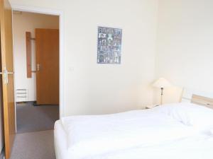 Ein Bett oder Betten in einem Zimmer der Unterkunft Gemütliches 2-Zimmer-Appartement mit Balkon.