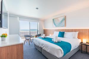 Postel nebo postele na pokoji v ubytování Scamander Beach Resort