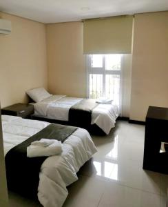 Llit o llits en una habitació de Amplio Apartamento a metros de shoping del sol