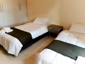 Llit o llits en una habitació de Amplio Apartamento a metros de shoping del sol