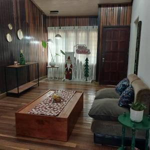 a living room with a couch and a coffee table at La esquina in Dos de Mayo