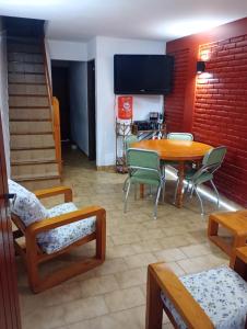 a dining room with a table and chairs at Duplexsanber in San Bernardo