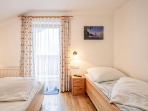 Postel nebo postele na pokoji v ubytování Haus Filzstein