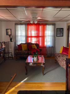 a living room with a couch and a table at Rancho silvestre in Monte Plata