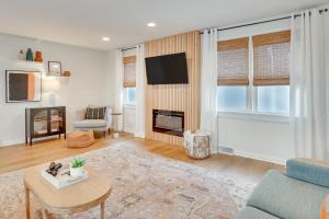 a living room with a couch and a table at Patio and Lake Views Family-Friendly Canton Retreat in Canton