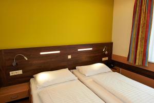 Rúm í herbergi á Hotel Kolping Wien Zentral