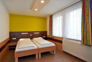 Rúm í herbergi á Hotel Kolping Wien Zentral