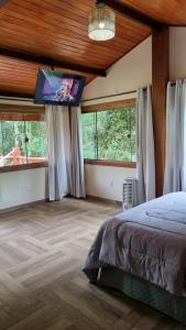 Voodi või voodid majutusasutuse Pousada Muro de Pedra toas