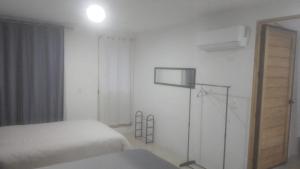Katil atau katil-katil dalam bilik di Departamentos RomTen +3 gambar