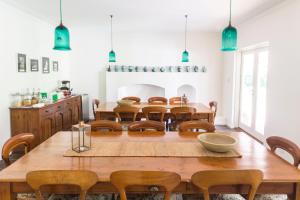 a dining room with a large wooden table and chairs at Gilgara Retreat in Margaret River Town