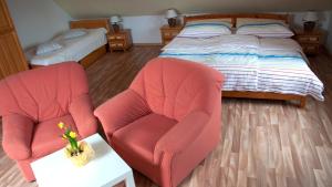 מיטה או מיטות בחדר ב-Apartments Odměny U Třeboně