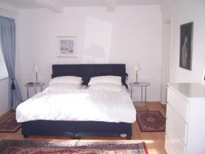 En eller flere senge i et værelse på Frisian house Wallsbuell