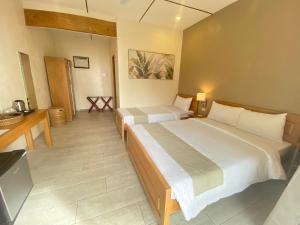 Letto o letti in una camera di SeTu Divespot & Resort