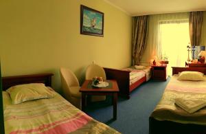 Posteľ alebo postele v izbe v ubytovaní Hotel Spinaker
