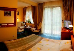 Posteľ alebo postele v izbe v ubytovaní Hotel Spinaker