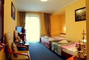 Posteľ alebo postele v izbe v ubytovaní Hotel Spinaker