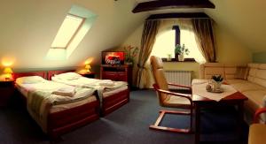 Posteľ alebo postele v izbe v ubytovaní Hotel Spinaker