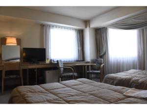 Postel nebo postele na pokoji v ubytování Silk Hotel