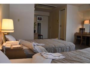 Postel nebo postele na pokoji v ubytování Silk Hotel