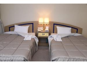 Postel nebo postele na pokoji v ubytování Silk Hotel