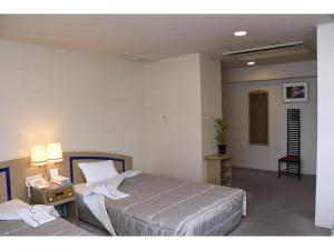 Postel nebo postele na pokoji v ubytování Silk Hotel