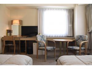 TV a/nebo společenská místnost v ubytování Silk Hotel