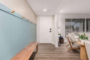 a room with a door and a table and chairs at NEW The Mesquite Retreat on Oak Entertainers Oasis in Scottsdale
