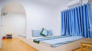 Postel nebo postele na pokoji v ubytování Homstay Sơn Thủy + 1 fotografie
