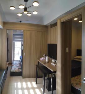 Ένα ή περισσότερα κρεβάτια σε δωμάτιο στο Condo next door