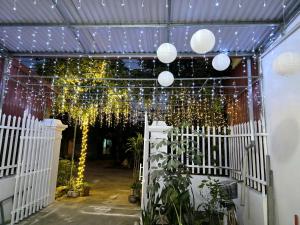 a greenhouse with lights and plants in it at Long tearm rental-Whole house with swimming pool in Kỳ Vĩ +12 photos