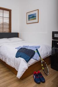 A bed or beds in a room at Rumanami Residence
