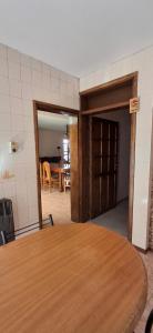 a room with a table and a dining room at Casa del centro in San Martín